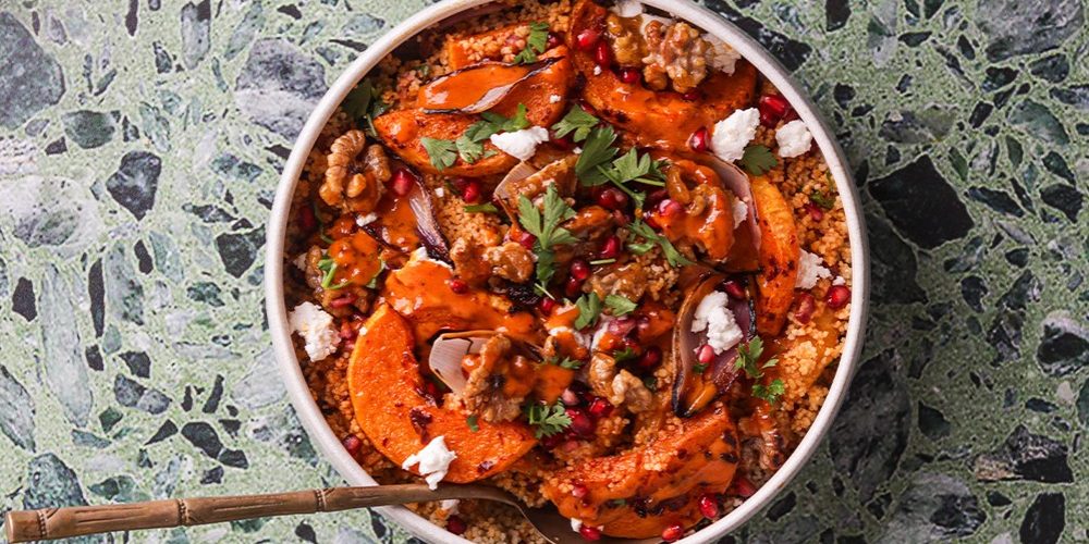 Festive harissa couscous with roasted butternut, walnuts, herbs and creamy dressing