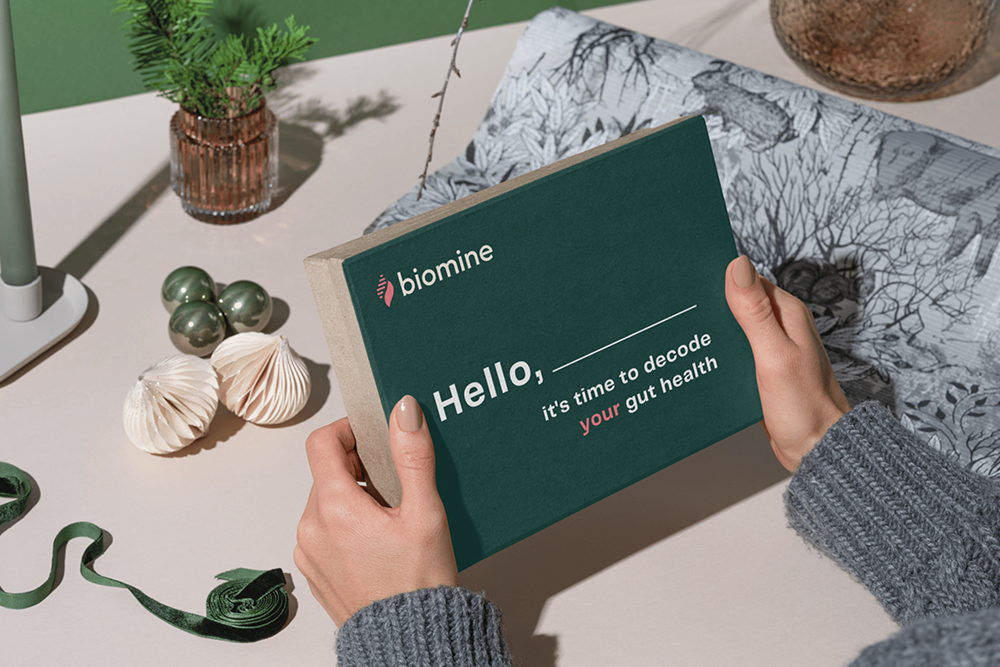 Holding the Biomine Health Gut Microbiome Test Kit