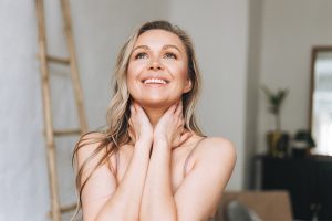 Happy women loving her body during pregnancy